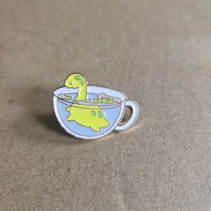 Cute Dinosaur in Teacup Enamel Pin